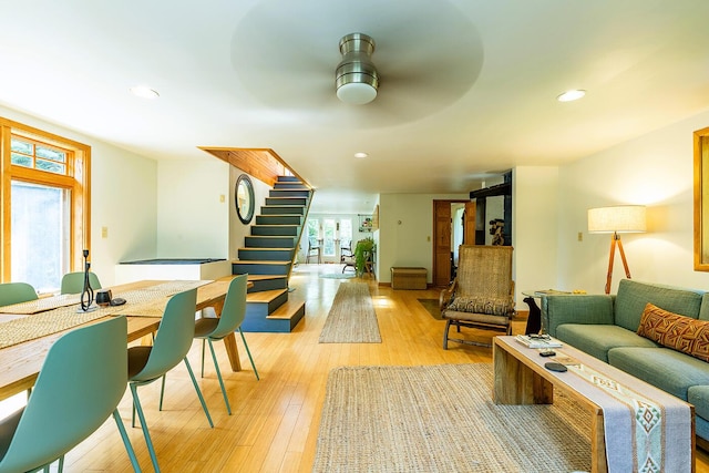 living area featuring light wood-style floors, stairs, a ceiling fan, and recessed lighting