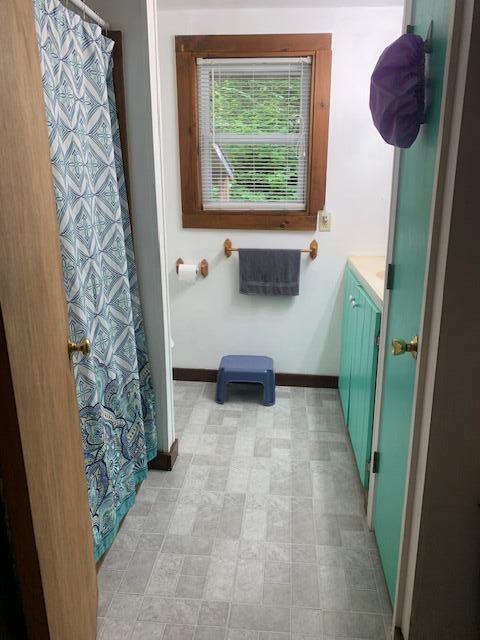 bathroom with tile patterned flooring and vanity