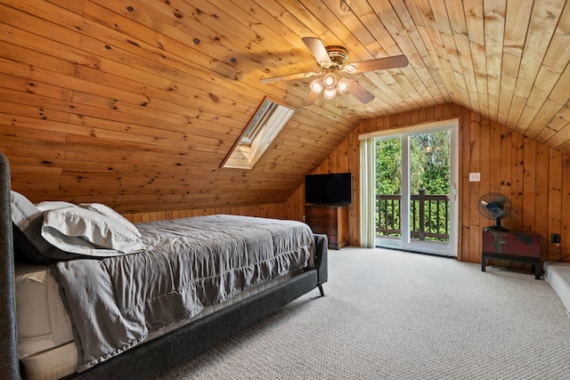 carpeted bedroom featuring wood ceiling, wooden walls, and lofted ceiling with skylight