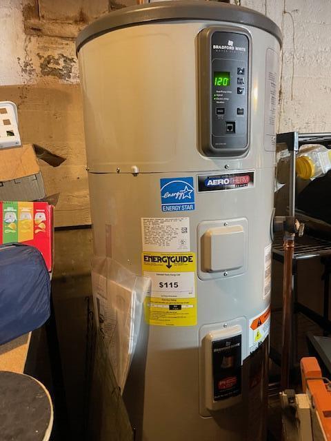 utility room featuring hybrid water heater