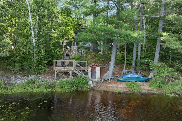 view of dock featuring a deck with water view