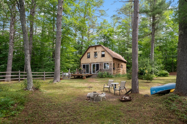 rear view of house with a lawn