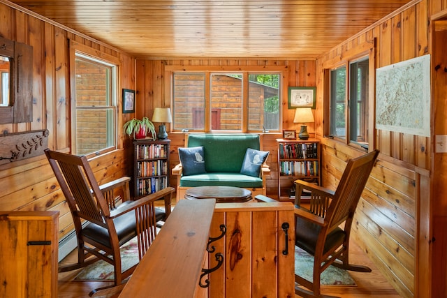 sunroom / solarium with wooden ceiling and a baseboard radiator