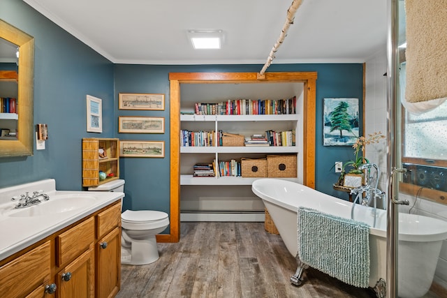 bathroom with wood-type flooring, baseboard heating, vanity, a bathtub, and toilet