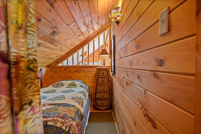 unfurnished bedroom featuring wood walls and wood ceiling