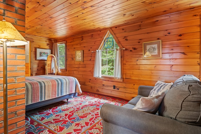 bedroom with wood walls, wood ceiling, and brick wall