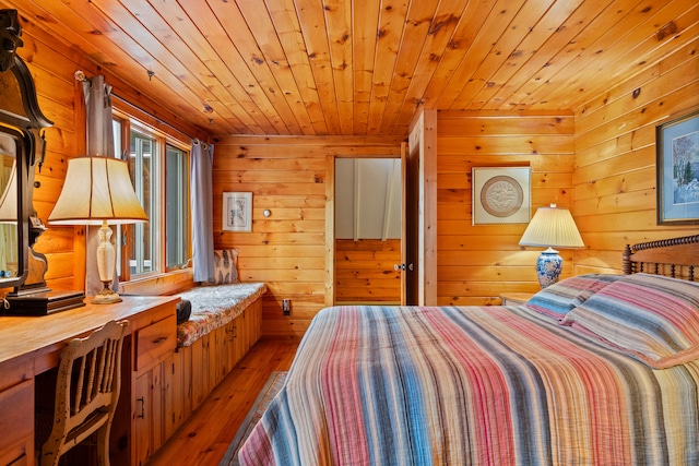 bedroom featuring wooden ceiling, wood-type flooring, and wooden walls