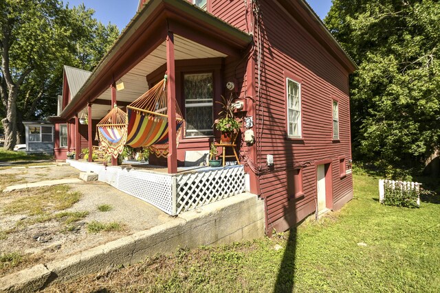 view of home's exterior with a lawn