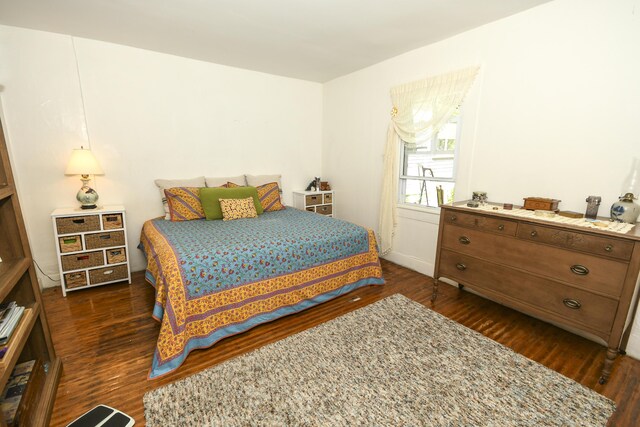 bedroom featuring dark wood-type flooring