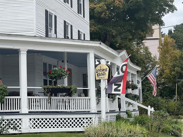 view of side of home featuring a porch