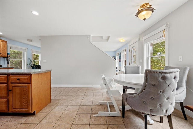 dining area featuring light tile patterned floors