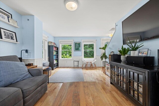 living room with light hardwood / wood-style flooring