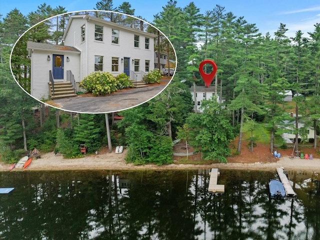 rear view of property featuring a water view