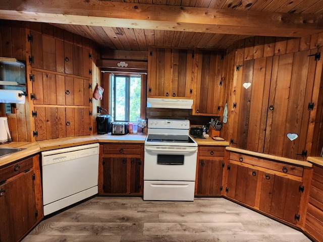 kitchen with beamed ceiling, white appliances, wood walls, and wooden ceiling