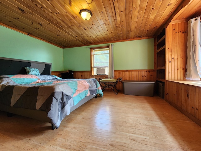 bedroom with light hardwood / wood-style floors, wood ceiling, cooling unit, and wood walls