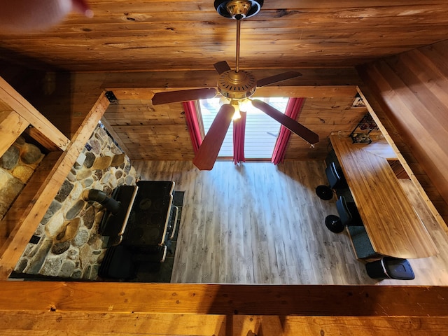 interior space featuring ceiling fan and wooden ceiling