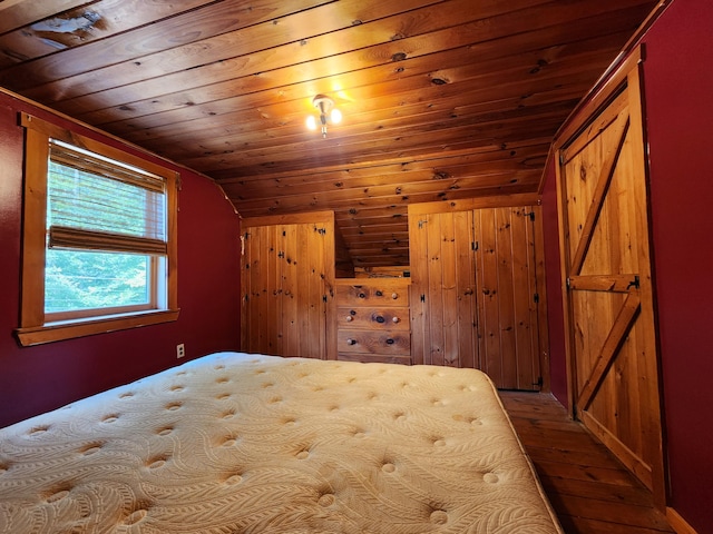 bedroom with wood ceiling, wood-type flooring, and lofted ceiling