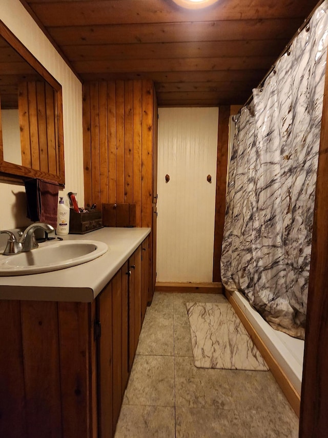 bathroom with vanity and wood ceiling