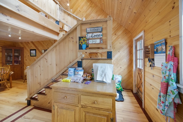 interior space with hardwood / wood-style flooring, lofted ceiling, wooden walls, and wooden ceiling