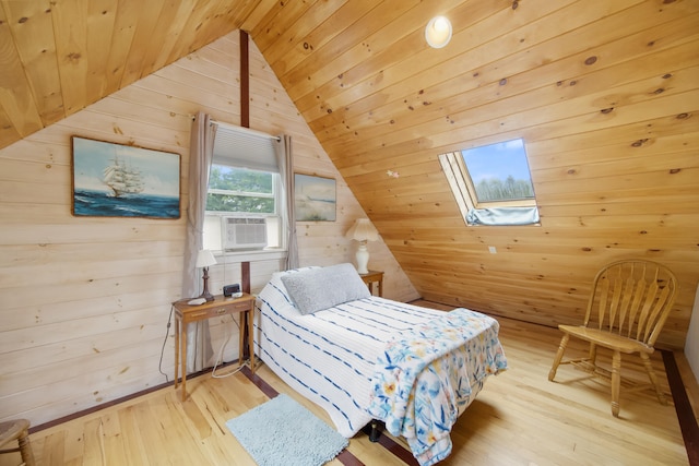 bedroom with light wood-type flooring, wood walls, wooden ceiling, and vaulted ceiling with skylight