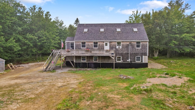 back of property featuring a wooden deck