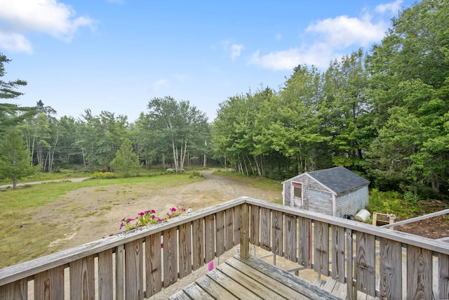 wooden terrace with a storage shed