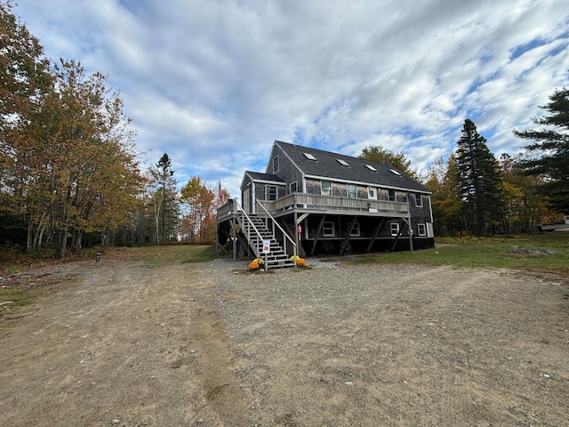 view of front of property with a wooden deck