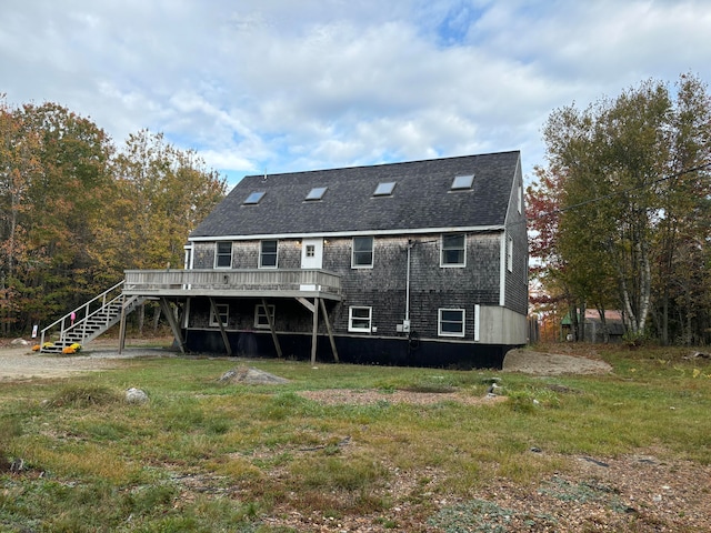 back of house featuring a wooden deck