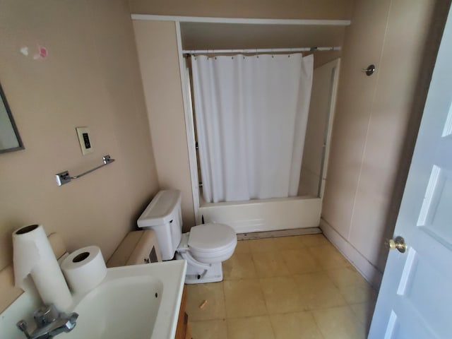 full bathroom with toilet, vanity, shower / bath combo with shower curtain, and tile patterned floors