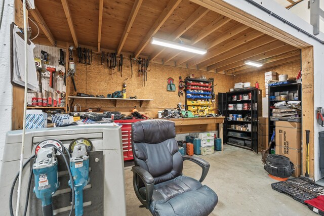 basement with a workshop area