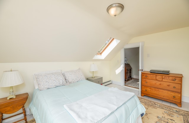 bedroom featuring light tile patterned flooring, vaulted ceiling, and a baseboard radiator