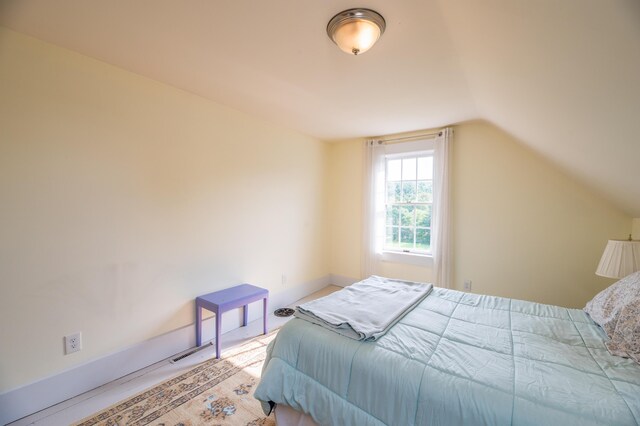 bedroom with vaulted ceiling