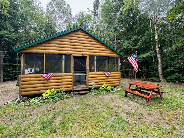 exterior space with log veneer siding