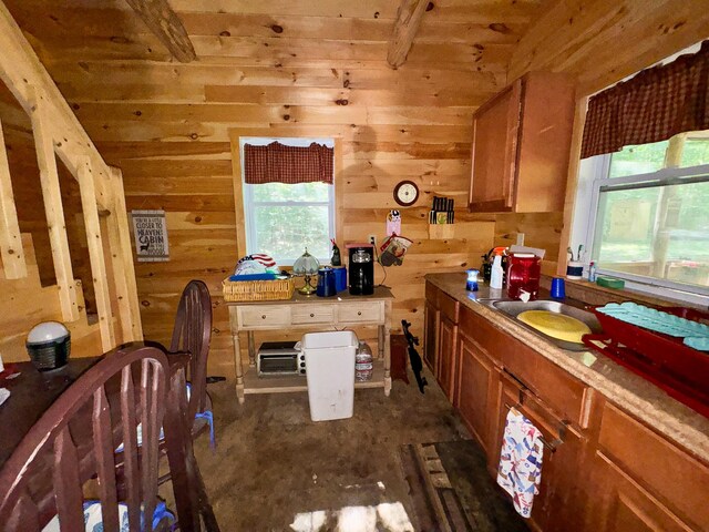 kitchen with wood walls and sink