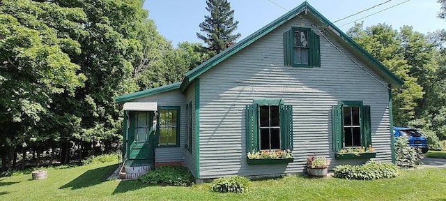 view of home's exterior featuring a yard