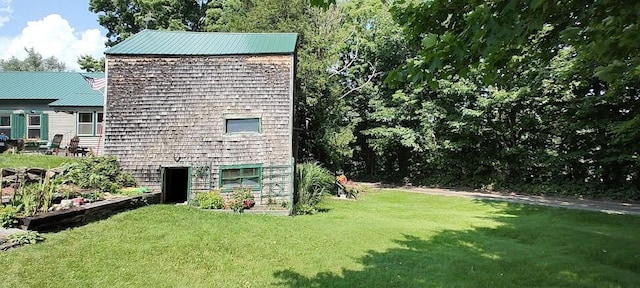 view of home's exterior featuring a lawn