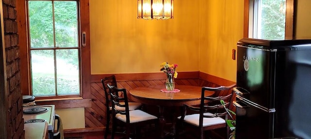 dining space featuring a notable chandelier