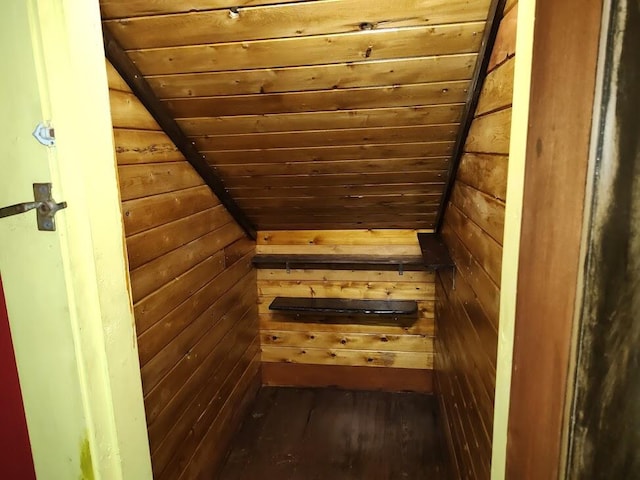 interior space featuring wooden walls, wood-type flooring, and wood ceiling