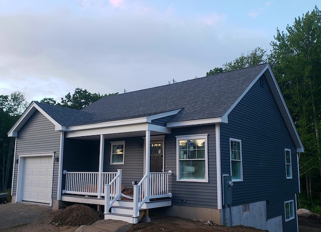 view of front of house featuring a garage and covered porch