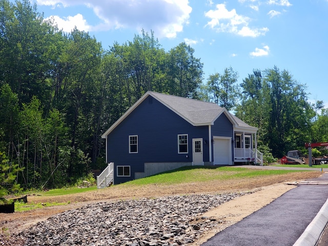 view of property exterior with a garage