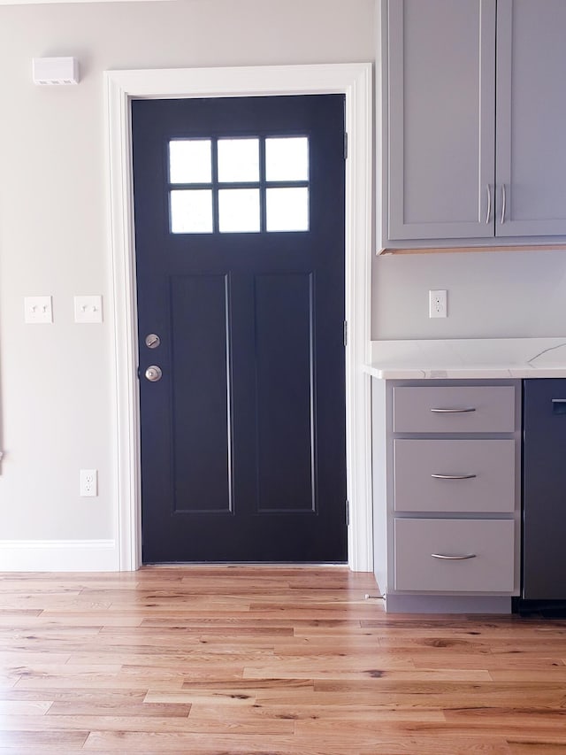 entrance foyer with light hardwood / wood-style flooring