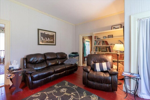 living room with hardwood / wood-style floors and crown molding