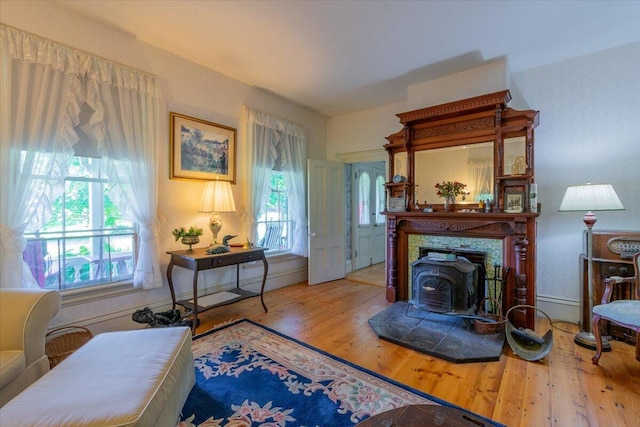 292300 Main Rd, Islesboro, ME 04848 - living area with wood finished floors and a wood stove
