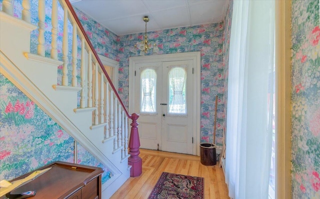 292300 Main Rd, Islesboro, ME 04848 - entryway with stairs, wallpapered walls, wood finished floors, and french doors
