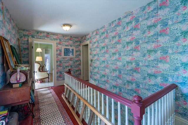 292300 Main Rd, Islesboro, ME 04848 - corridor with wallpapered walls, baseboards, and wood finished floors