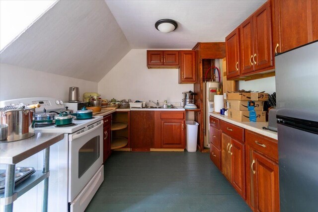 kitchen featuring vaulted ceiling, white electric stove, stainless steel refrigerator, and sink