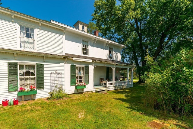 292300 Main Rd, Islesboro, ME 04848 - back of property featuring a lawn and covered porch