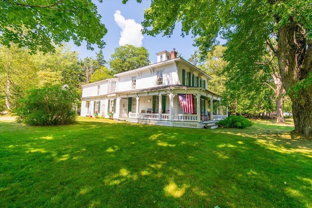 292300 Main Rd, Islesboro, ME 04848 - back of property with a lawn, a chimney, and a porch