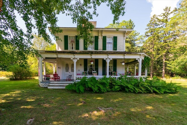 view of front of house with a front lawn and a porch