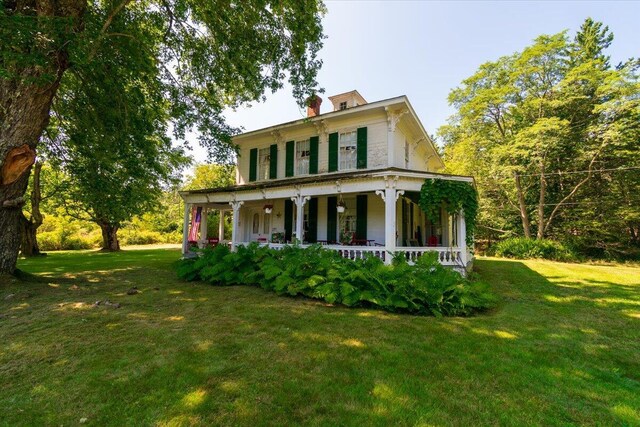 view of front of house with a front lawn and a porch